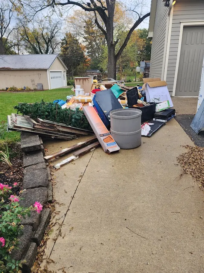 Dumpster being loaded with debris for 3 Yard Dumpster Rental in Middletown